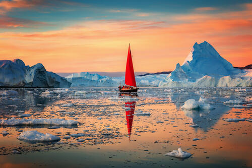Red sail in the ocean
