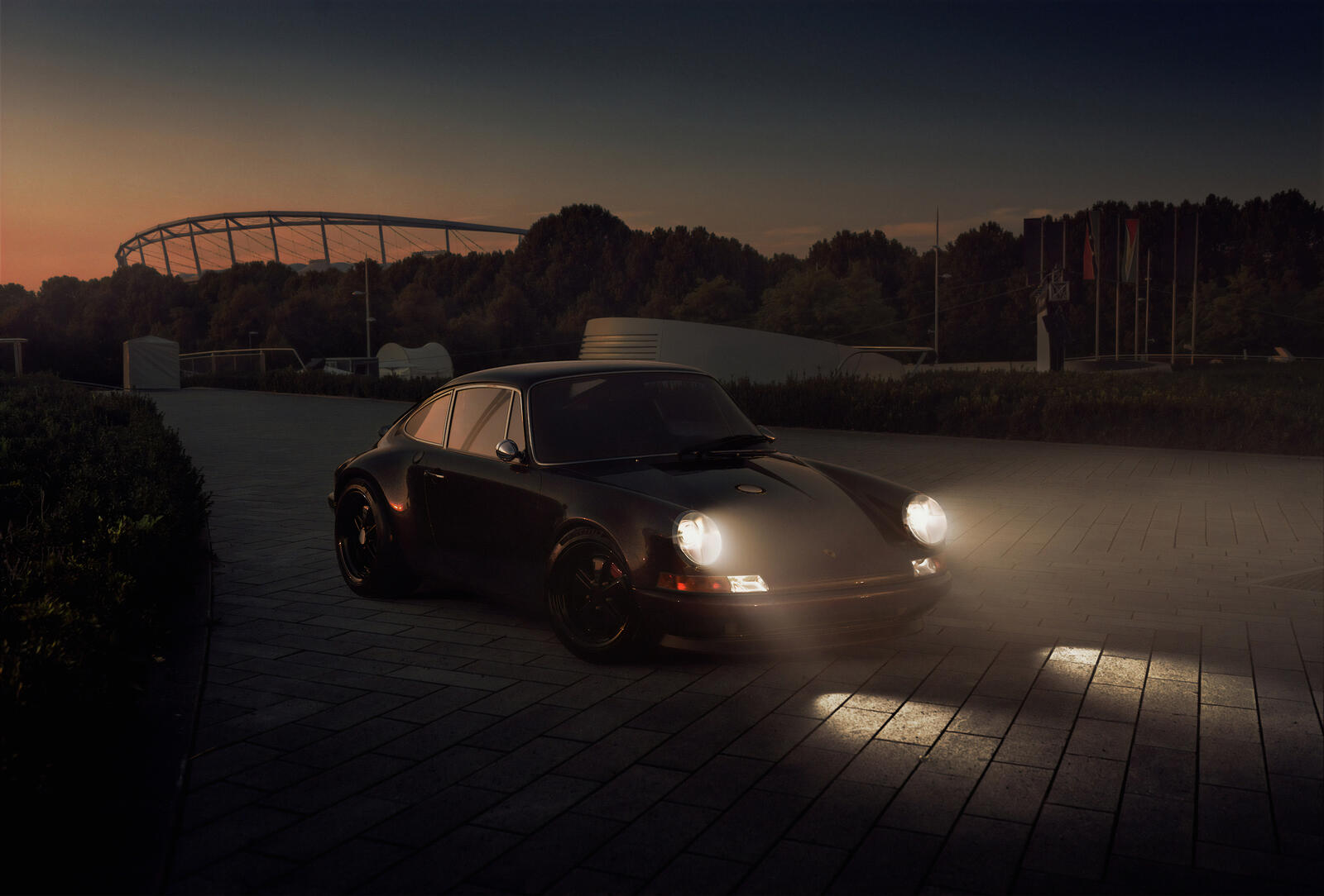 Free photo Porsche with headlights on