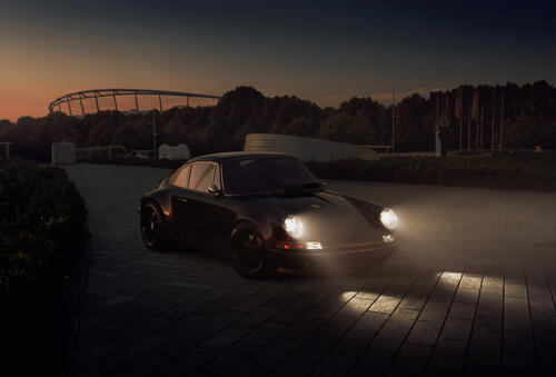 Porsche with headlights on