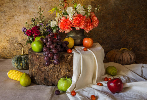 Fruit, grapes and a carnation