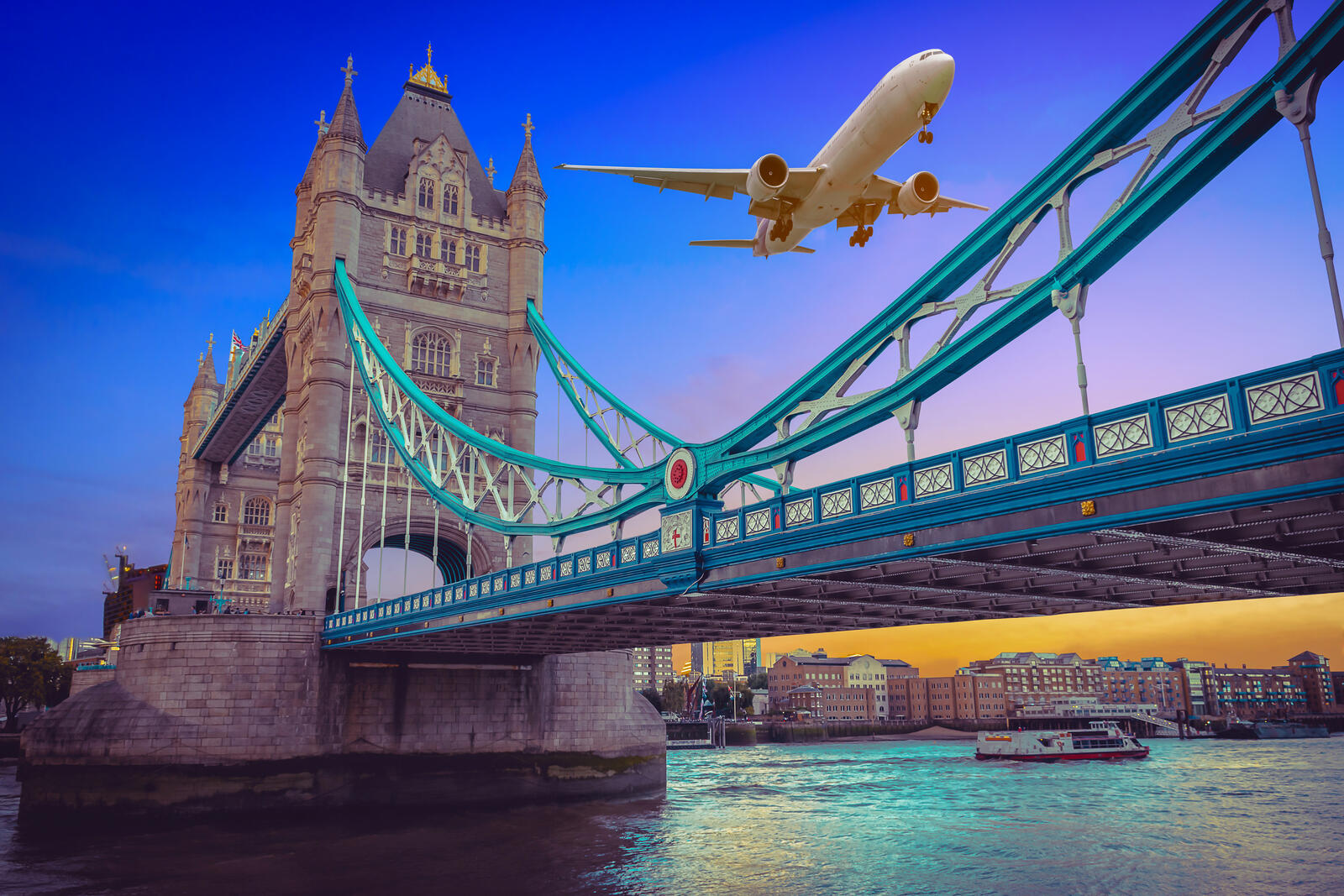 Wallpapers Plane flying over Tower Bridge at sunset in London London UK on the desktop