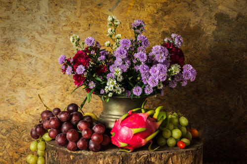 Grapes, artichokes and floral bouquet