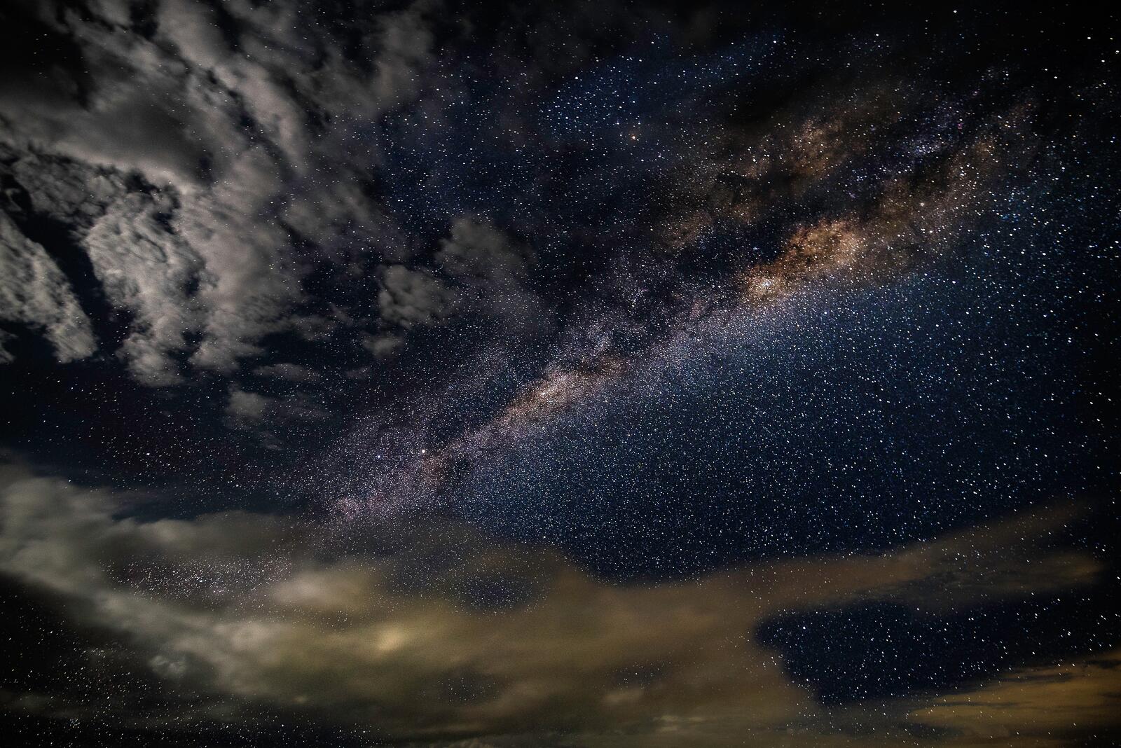 Free photo Black clouds and the milky way with the stars