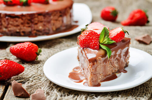 A piece of cake with strawberries