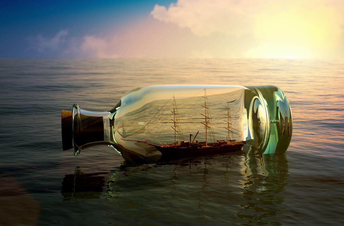 Ship in a bottle floating on the waves