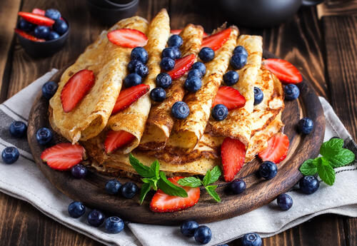 Pancakes with strawberries and blueberries
