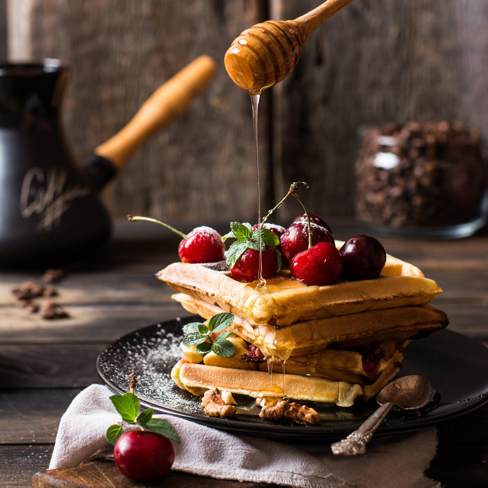 Free photo Homemade waffles with honey and cherries
