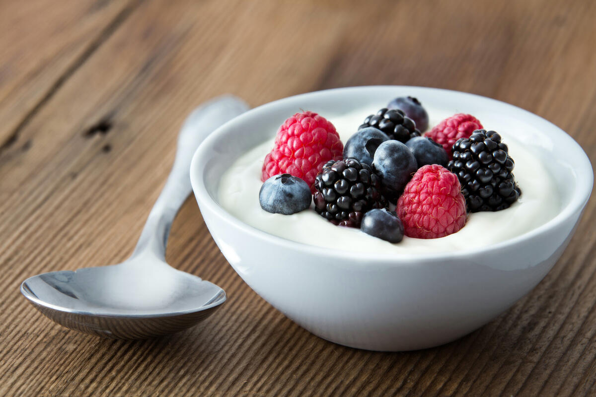 Berries and sour cream in a bowl