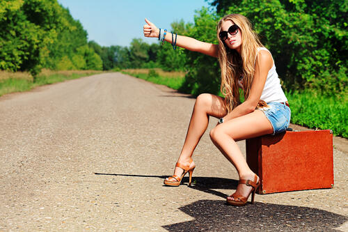 the girl hitchhiking