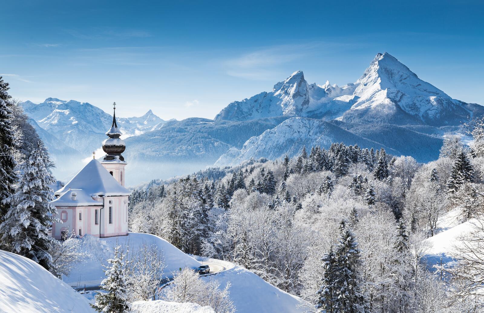 Free photo White church in the snowy mountains