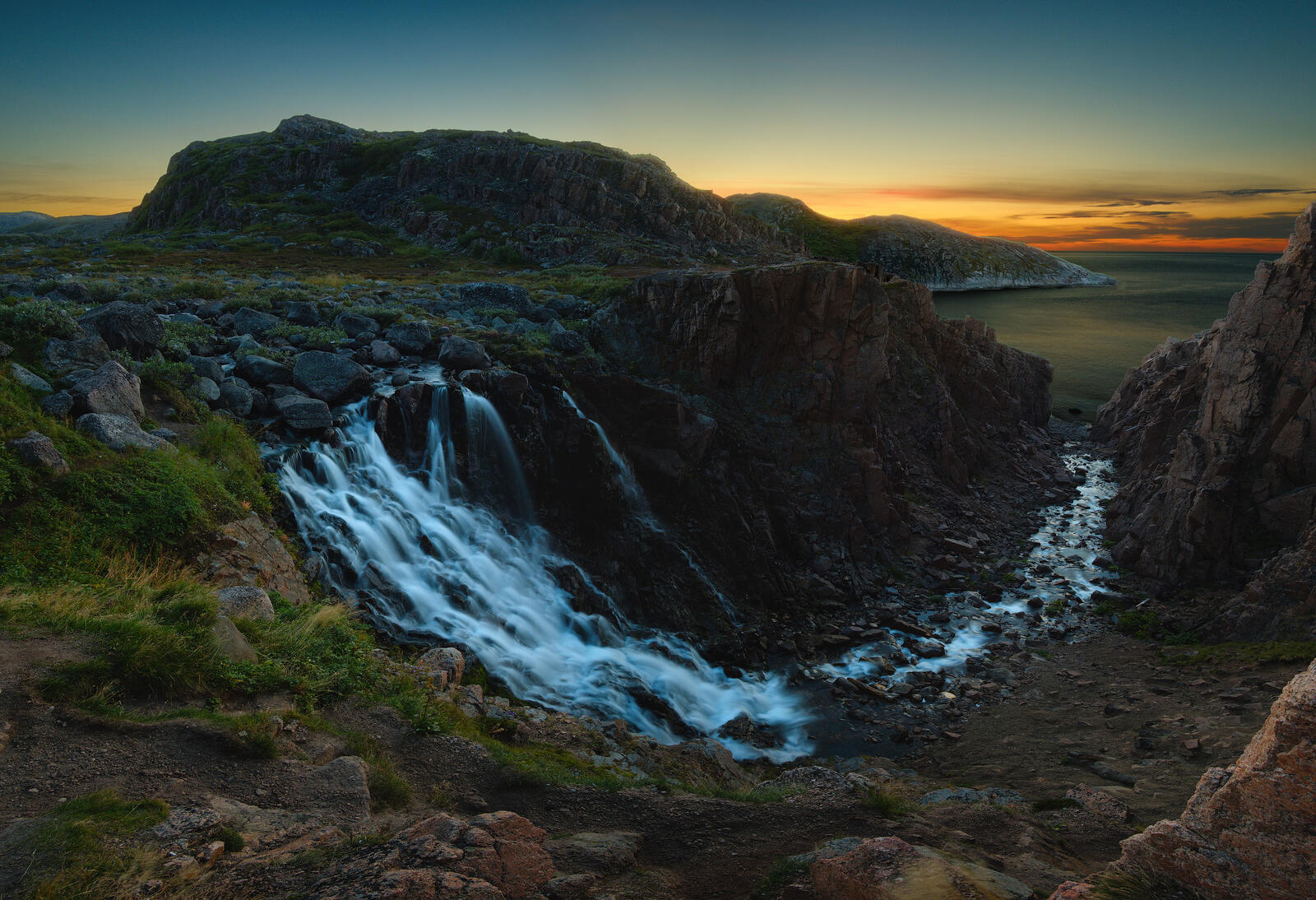 Free photo Waterfall in the arctic twilight