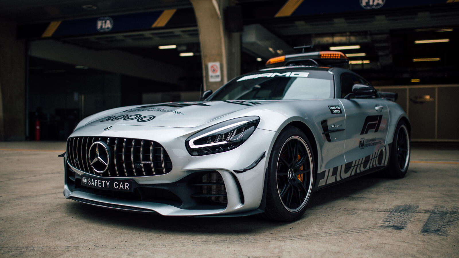 Free photo Mercedes AMG GT C with flashing lights leaves the tunnel