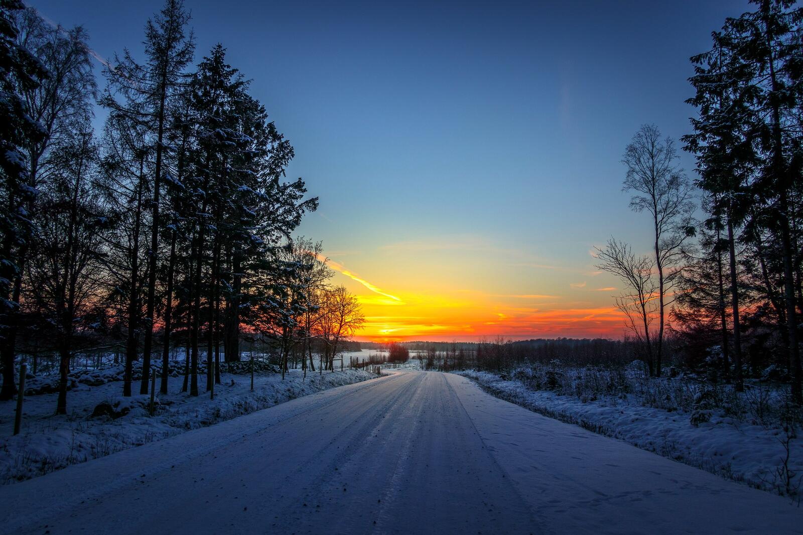 Free photo Winter road at sunset