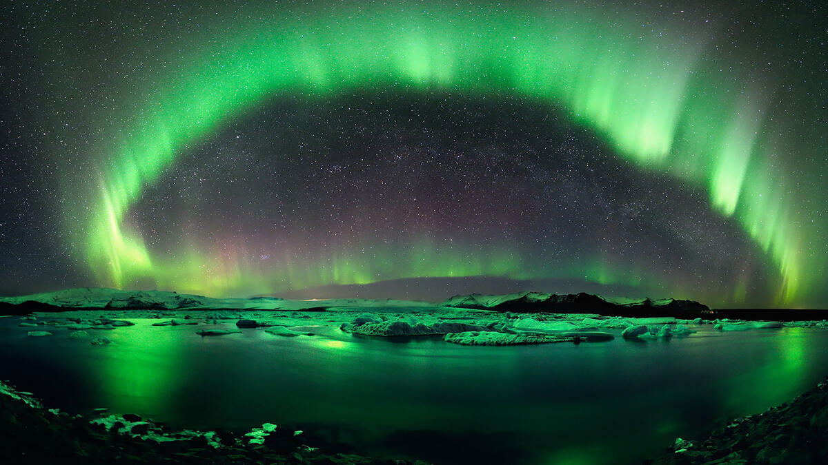 Very bright northern lights over the water