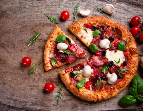 Pizza with meat and mushrooms