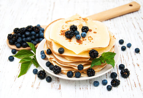 A stack of pancakes with berries
