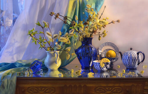 Sprigs of willow in a blue vase
