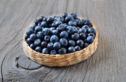 Blueberries on a wooden background